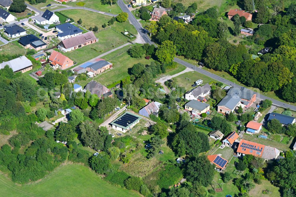 Aerial image Kenz - Construction site for the new construction of a detached house in a family house - settlement along the on street Zu den Dorfwiesen in Kenz in the state Mecklenburg - Western Pomerania, Germany