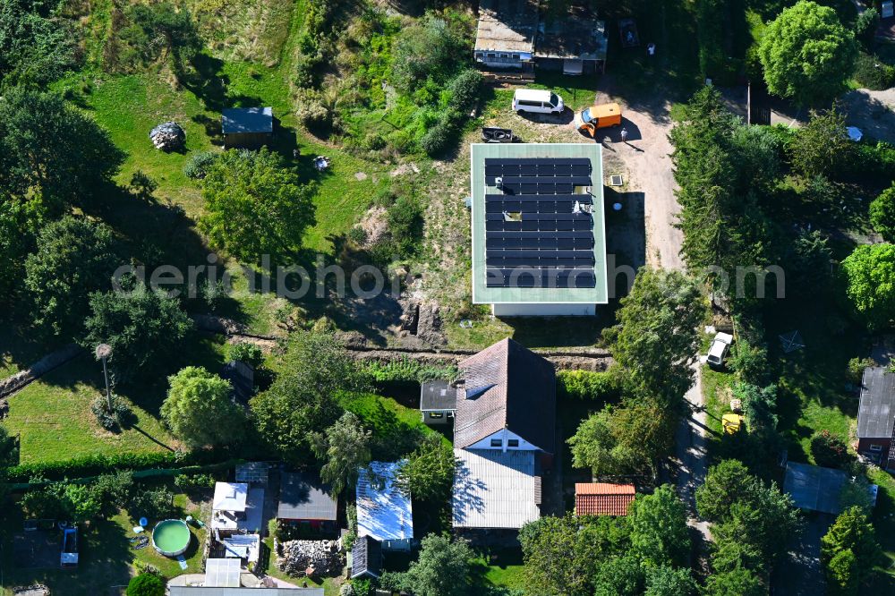 Kenz from the bird's eye view: Construction site for the new construction of a detached house in a family house - settlement along the on street Zu den Dorfwiesen in Kenz in the state Mecklenburg - Western Pomerania, Germany
