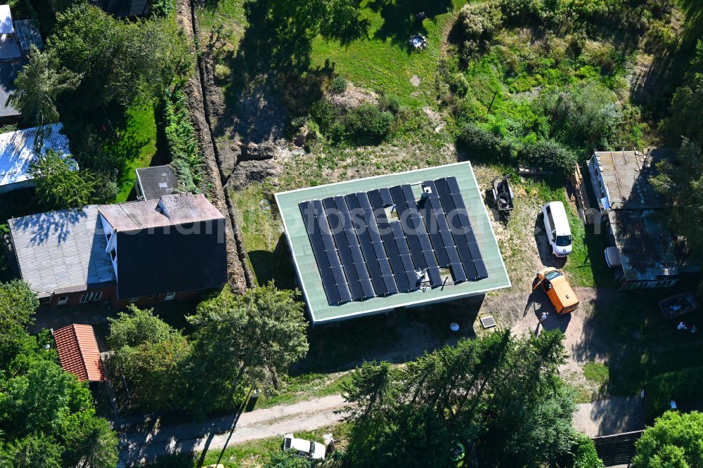 Kenz from above - Construction site for the new construction of a detached house in a family house - settlement along the on street Zu den Dorfwiesen in Kenz in the state Mecklenburg - Western Pomerania, Germany
