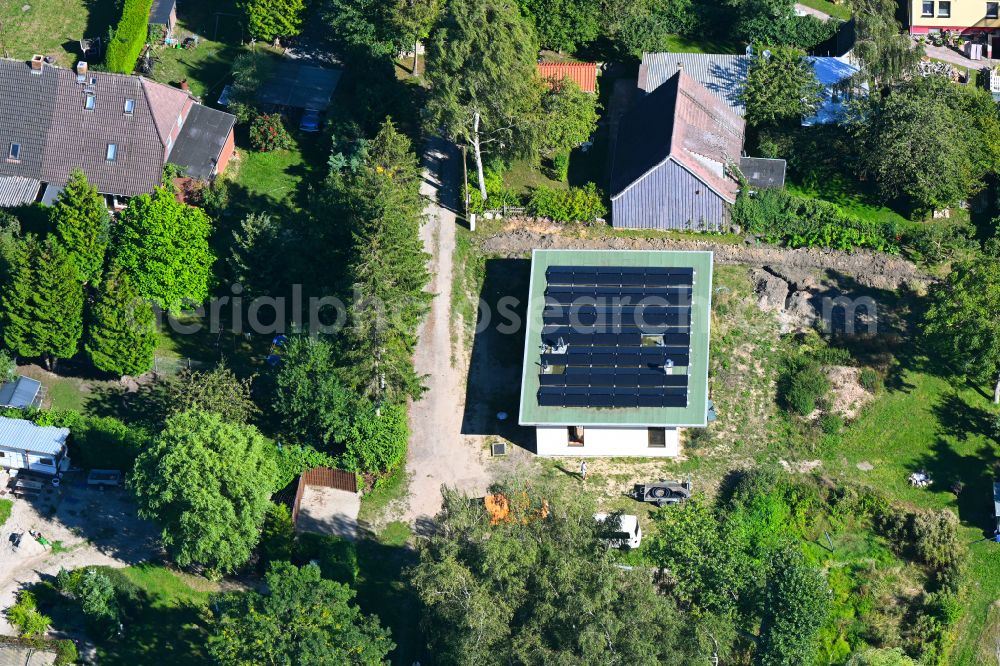 Aerial image Kenz - Construction site for the new construction of a detached house in a family house - settlement along the on street Zu den Dorfwiesen in Kenz in the state Mecklenburg - Western Pomerania, Germany