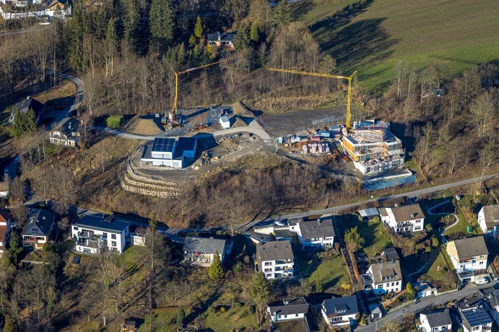 Aerial photograph Meschede - Construction site for the new construction of a detached house in a family house - settlement along the on street Unterm Hasenfeld in Meschede at Sauerland in the state North Rhine-Westphalia, Germany