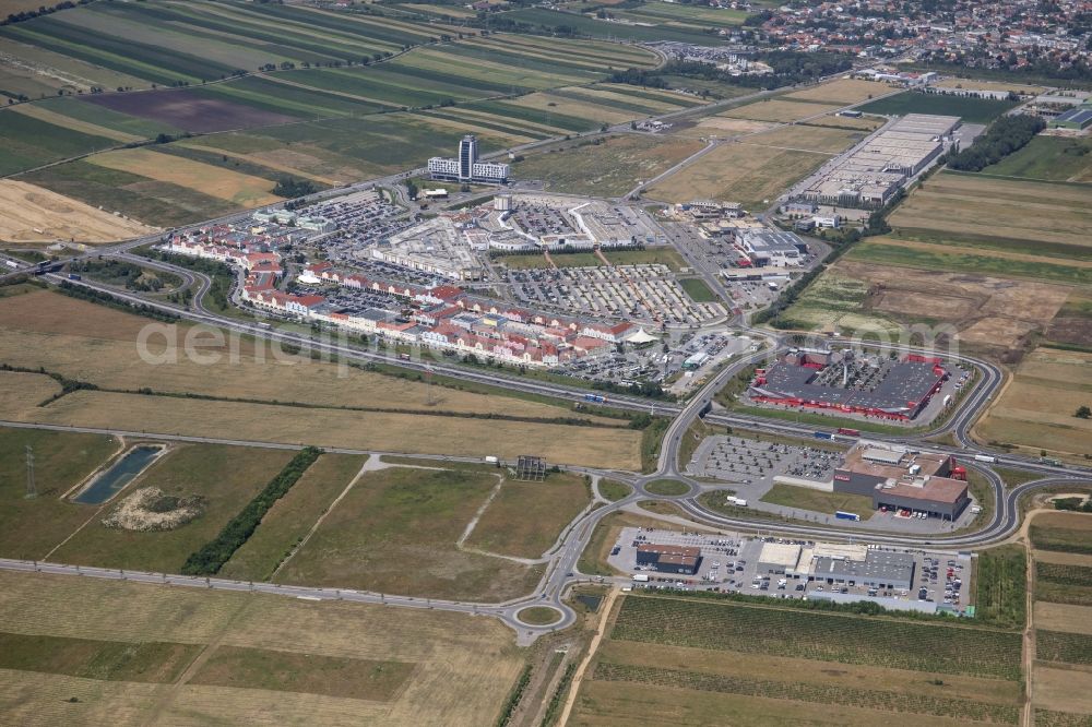 Parndorf from above - Building of the shopping center Parndorf Fashion Outlet in Parndorf in Burgenland, Austria