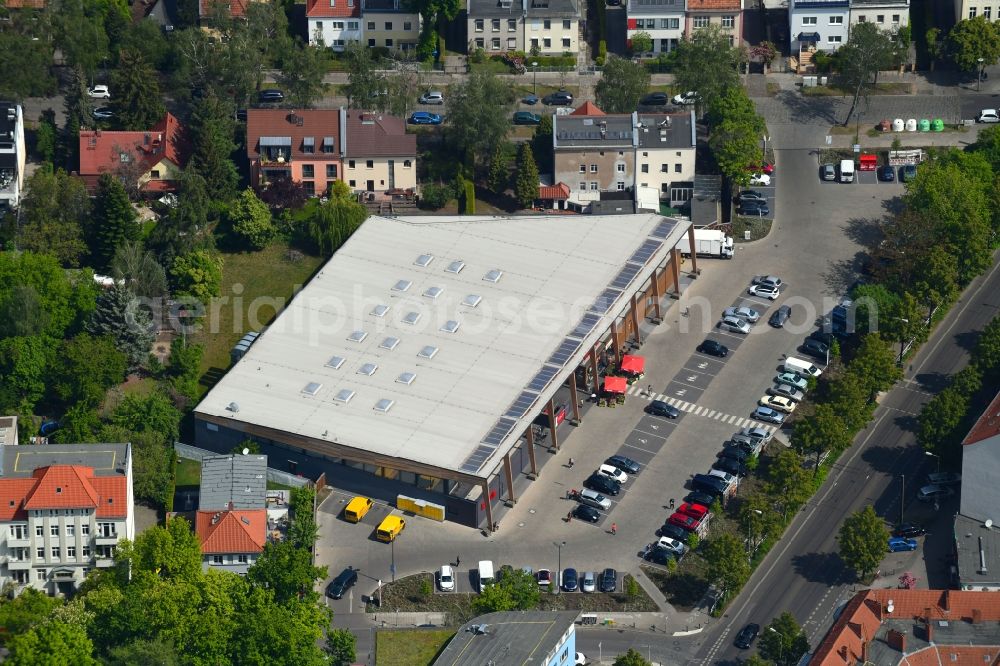 Aerial photograph Berlin - Building of the shopping center REWE on Konrad-Wolf-Strasse in the district Hohenschoenhausen in Berlin, Germany
