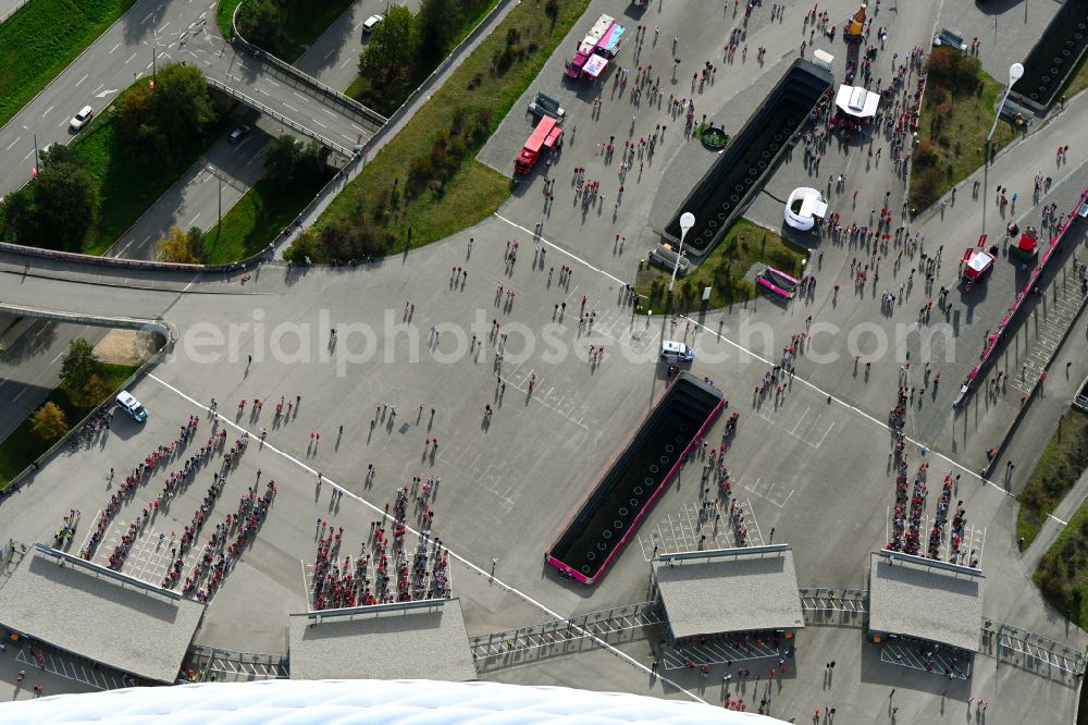 München from above - Crowds of people in front of the entrance control of football fans at the entrances to the security check on the sports facility grounds of the arena of the stadium Allianz Arena on Werner-Heisenberg-Allee in the district Freimann in Munich in the state Bavaria, Germany