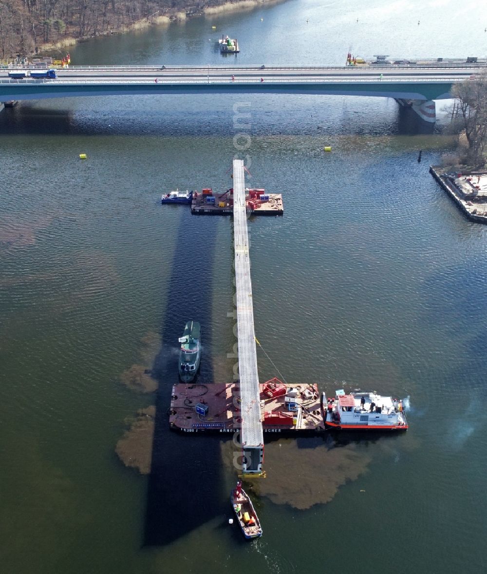 Aerial photograph Petersdorf - Floating in the last steel segment of the route and lanes in the course of the motorway bridge of the BAB A19 Petersdorfer Bruecke with construction site for a replacement new building in Petersdorf in the state of Mecklenburg-Western Pomerania