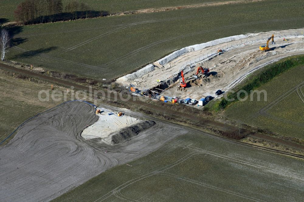Friedersdorf from the bird's eye view: Construction site with earthworks and landfills on train line crossing for the laying of pipelines of the new Europaeischen Gas-Anbindungsleitung ( Eugal ) in Friedersdorf in the state Brandenburg, Germany