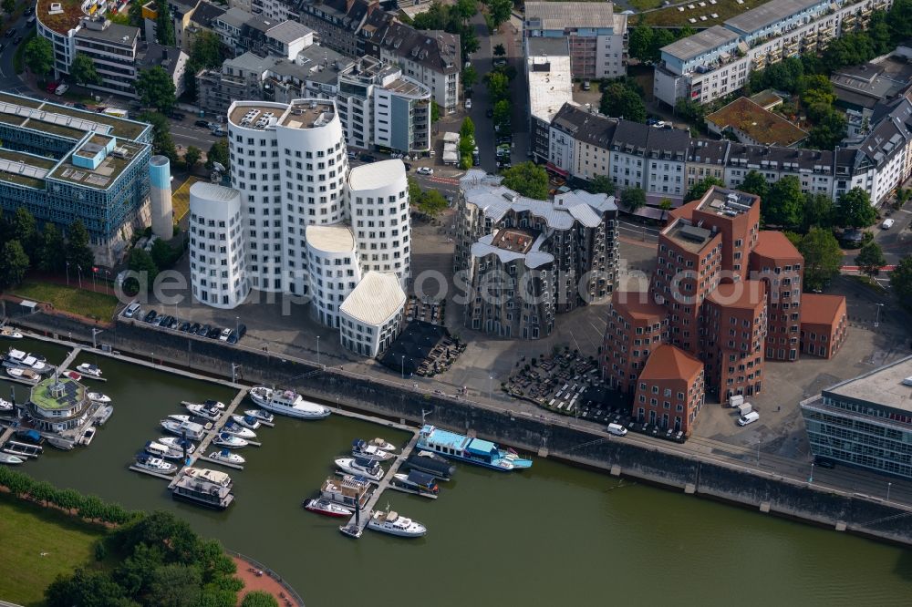 Düsseldorf from the bird's eye view: Office building Neuer Zollhof on Medienhafen on Ufer of Rhein in Duesseldorf at Ruhrgebiet in the state North Rhine-Westphalia, Germany. The Neuer Zollhof is a building ensemble in the Duesseldorf Media Harbor. The buildings are also known as Gehry buildings after their architect and designer Frank Gehry