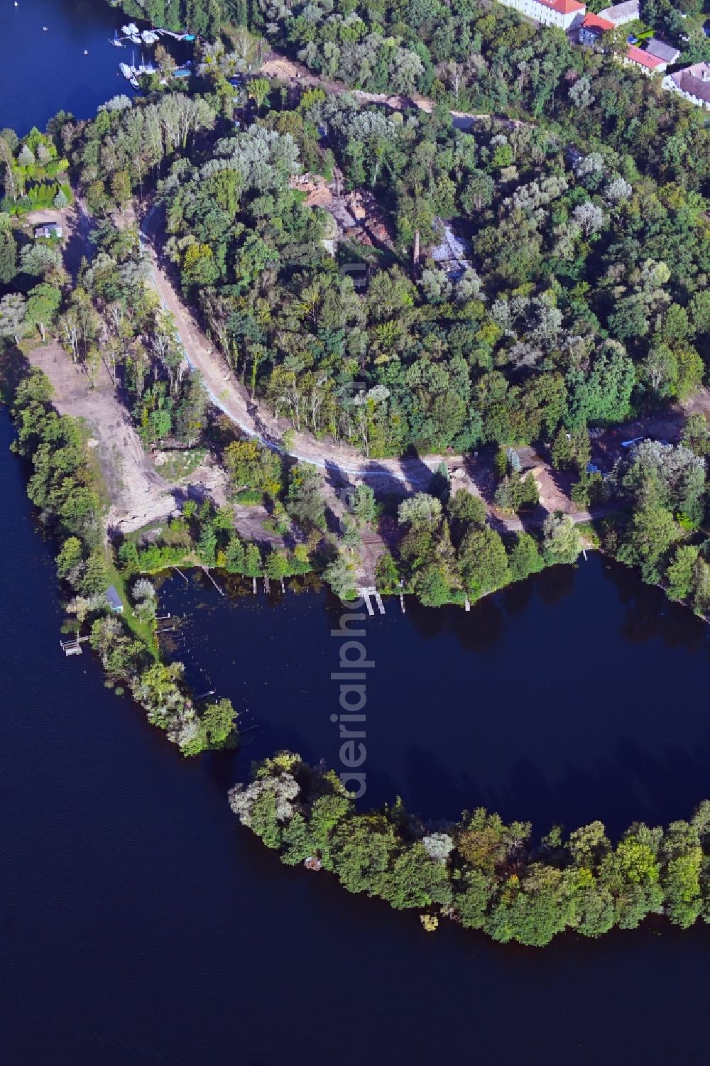 Hennickendorf from above - Development area and building land fallow in a bay on the banks of the Stienitzsee in Hennickendorf in the state Brandenburg, Germany