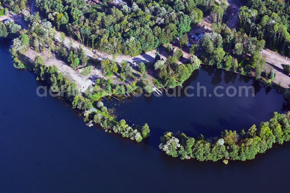 Hennickendorf from the bird's eye view: Development area and building land fallow in a bay on the banks of the Stienitzsee in Hennickendorf in the state Brandenburg, Germany