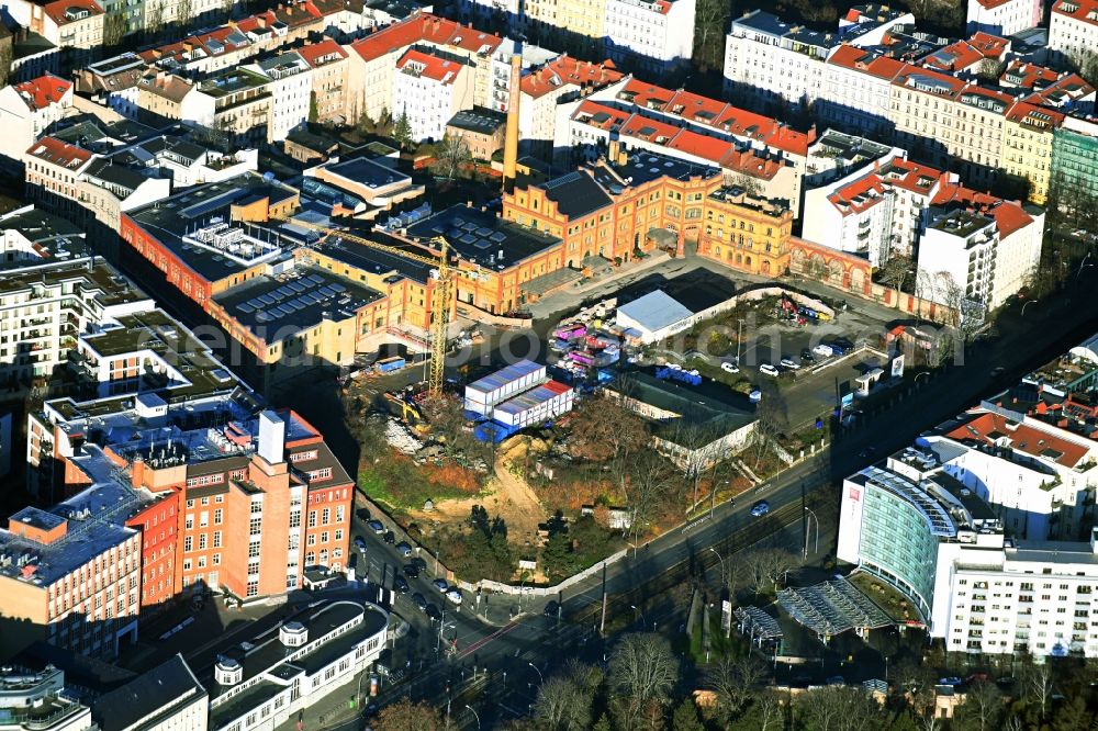 Berlin from the bird's eye view: Development area of the industrial wasteland Boetzow Brewery for conversion and new construction with apartments, offices, hotel, swimming pool, art house and shops on Prenzlauer Allee in the Prenzlauer Berg district in Berlin, Germany