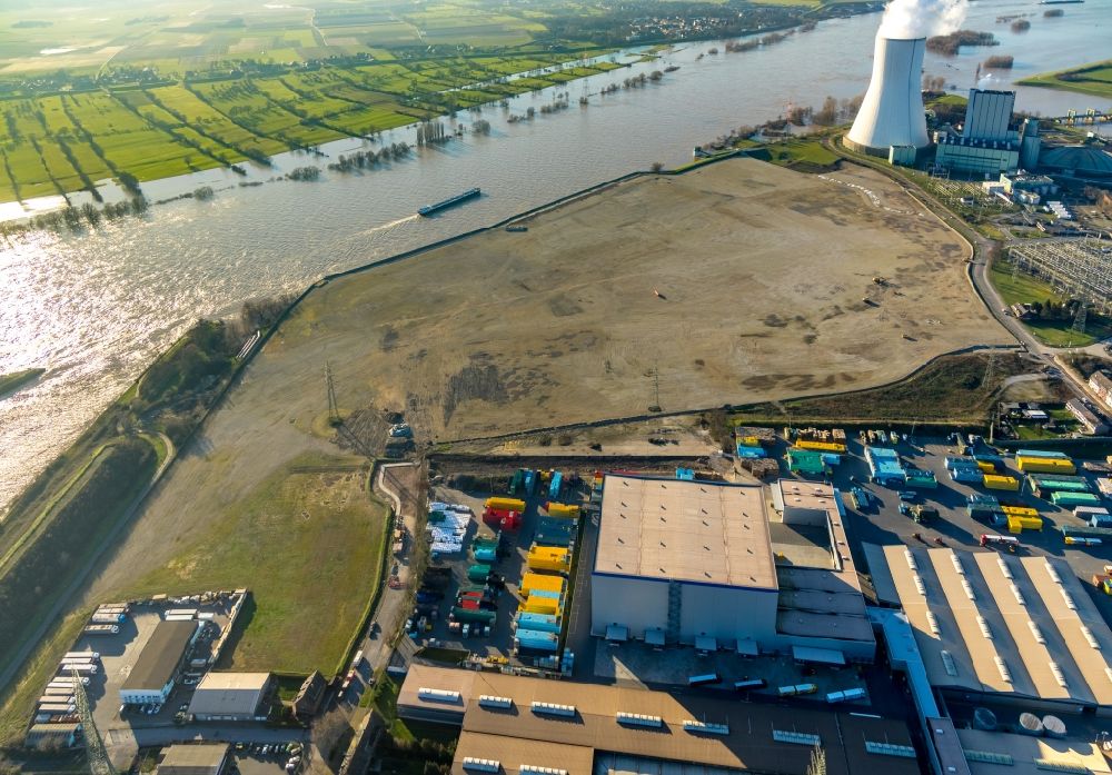 Duisburg from the bird's eye view: Development area of industrial wasteland Logport VI on shore of rhine river on destrict Walsum in Duisburg in the state North Rhine-Westphalia, Germany