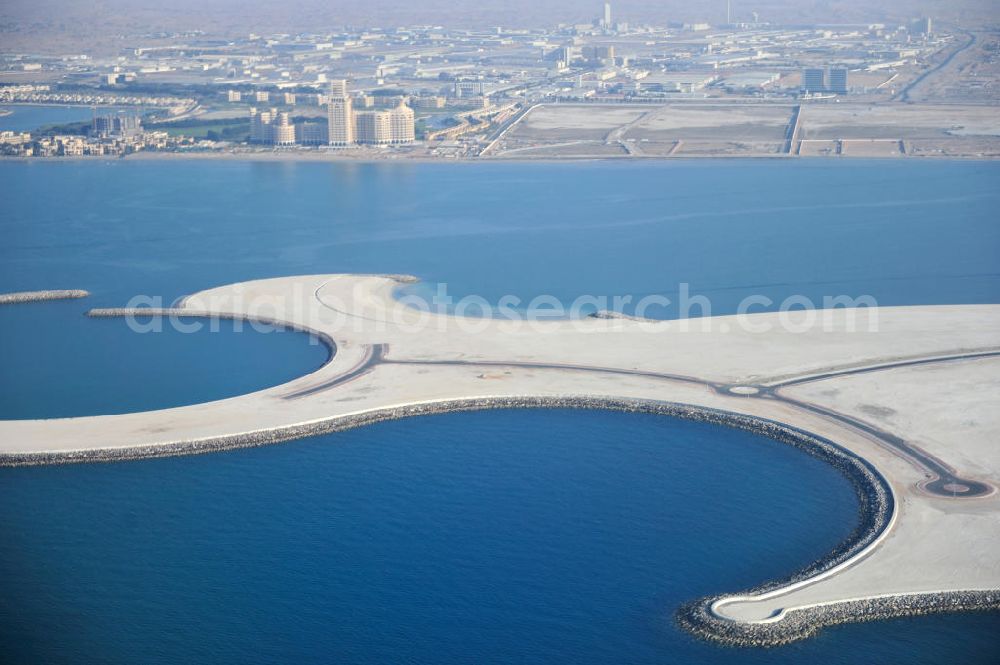 Ras Al Khaimah from the bird's eye view: Al Marjan Island is an artificial archipelago in the arab emirate Ras Al Khaimah. It is part of the Al Hamra Village Project. In the future, the archipelago is meant to be the arterial road for the region's tourism