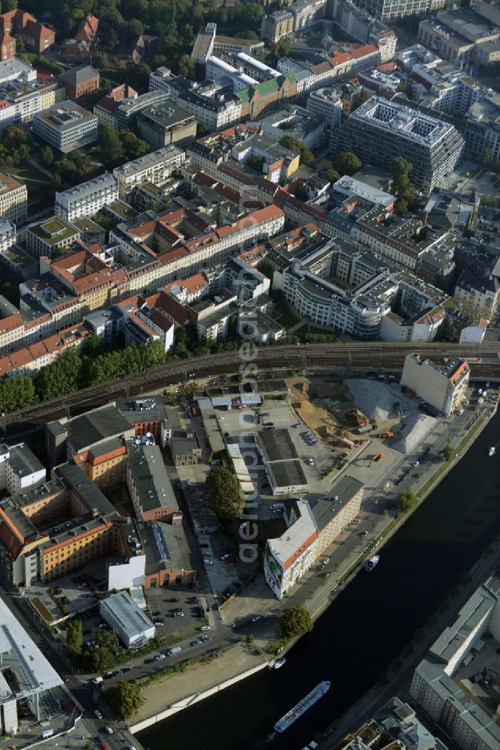 Aerial photograph Berlin - Developing field of residential and commercial space on Schiffbauerdamm on Spree river in the district Mitte in Berlin, Germany