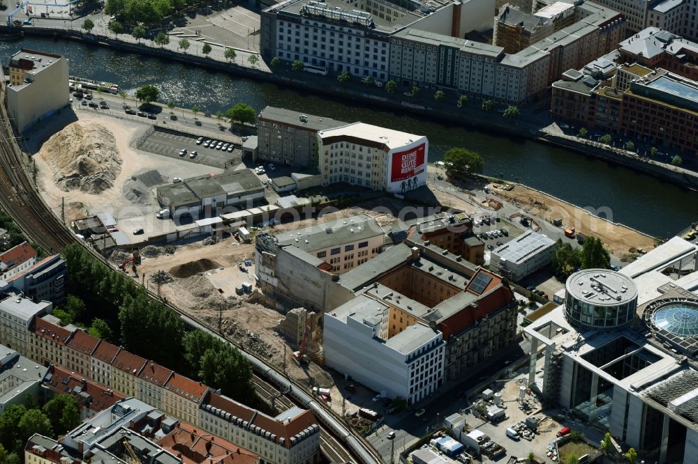 Aerial image Berlin - Developing field of residential and commercial space on Schiffbauerdamm on Spree river in the district Mitte in Berlin, Germany