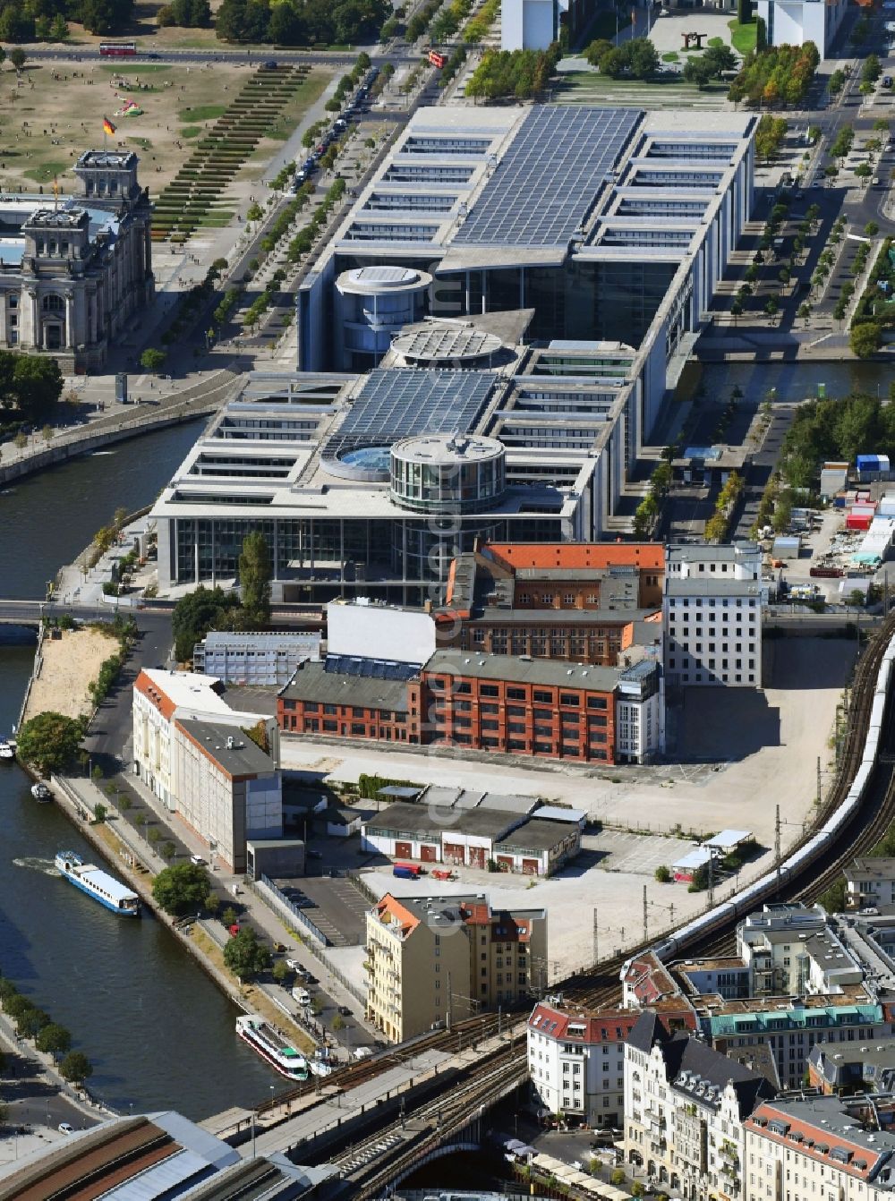 Berlin from above - Developing field of residential and commercial space on Schiffbauerdamm on Spree river in the district Mitte in Berlin, Germany