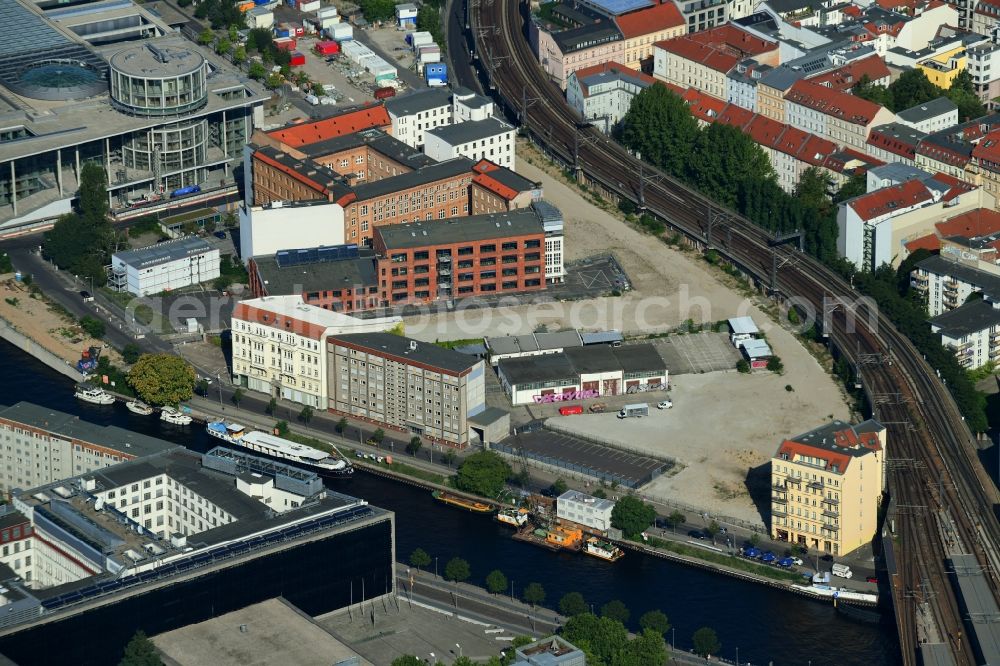 Berlin from above - Developing field of residential and commercial space on Schiffbauerdamm on Spree river in the district Mitte in Berlin, Germany