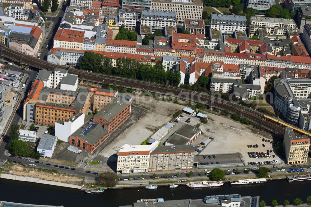 Berlin from the bird's eye view: Developing field of residential and commercial space on Schiffbauerdamm on Spree river in the district Mitte in Berlin, Germany