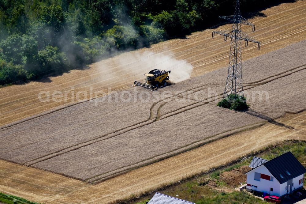 Aerial photograph Bovenden - Harvest use of heavy agricultural machinery - combine harvesters and harvesting vehicles on agricultural fields in Bovenden in the state Lower Saxony, Germany