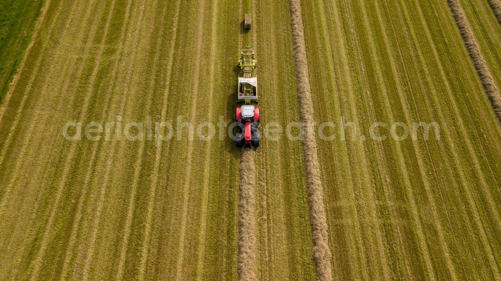 Aerial photograph Henrichenburg - Harvest use of heavy agricultural machinery - combine harvesters and harvesting vehicles on agricultural fields in Henrichenburg in the state North Rhine-Westphalia, Germany