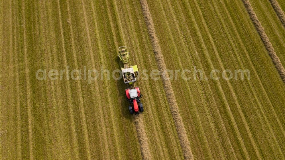Henrichenburg from above - Harvest use of heavy agricultural machinery - combine harvesters and harvesting vehicles on agricultural fields in Henrichenburg in the state North Rhine-Westphalia, Germany