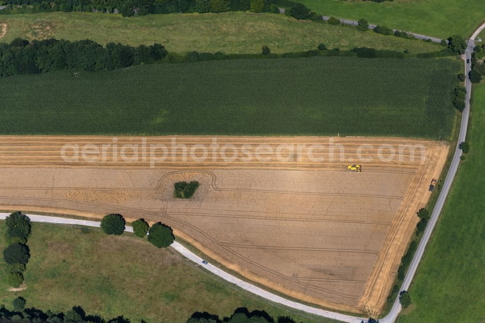 Aerial photograph Wankendorf - Harvest use of heavy agricultural machinery - combine harvesters and harvesting vehicles on agricultural fields in Wankendorf in the state Schleswig-Holstein, Germany