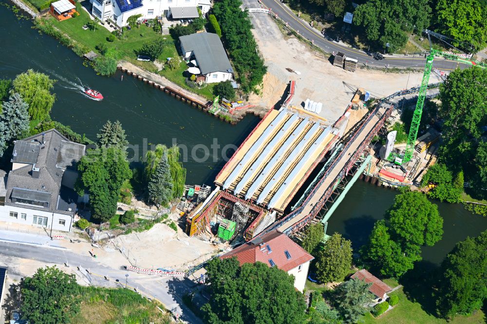 Woltersdorf from the bird's eye view: Construction site for a new replacement building for the renovation, renewal and repair of the bridge structure Ruedersdorfer Strasse in Woltersdorf in the state Brandenburg, Germany