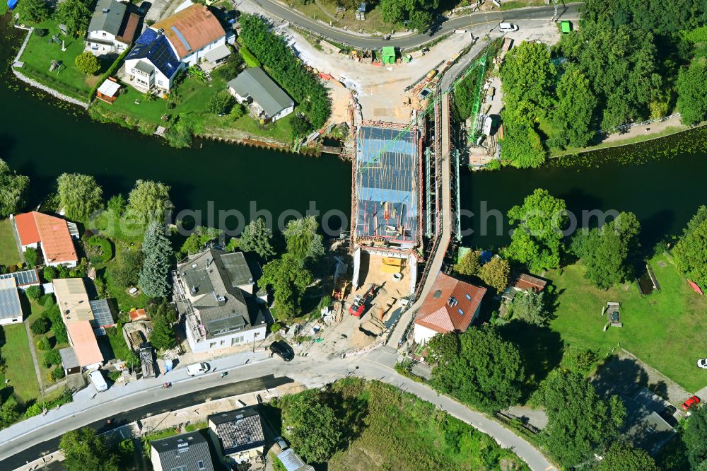 Woltersdorf from the bird's eye view: Construction site for a new replacement building for the renovation, renewal and repair of the bridge structure Ruedersdorfer Strasse in Woltersdorf in the state Brandenburg, Germany