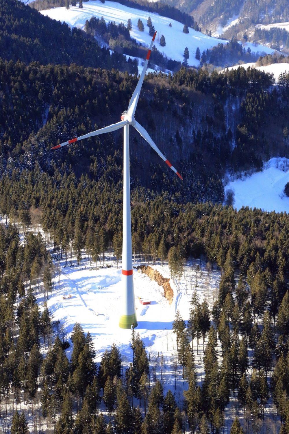 Aerial photograph Schopfheim - On the snow covered Rohrenkopf, the local mountain of Gersbach, a district of Schopfheim in Baden-Wuerttemberg, wind turbines have started operation. It is the first wind farm in the south of the Black Forest