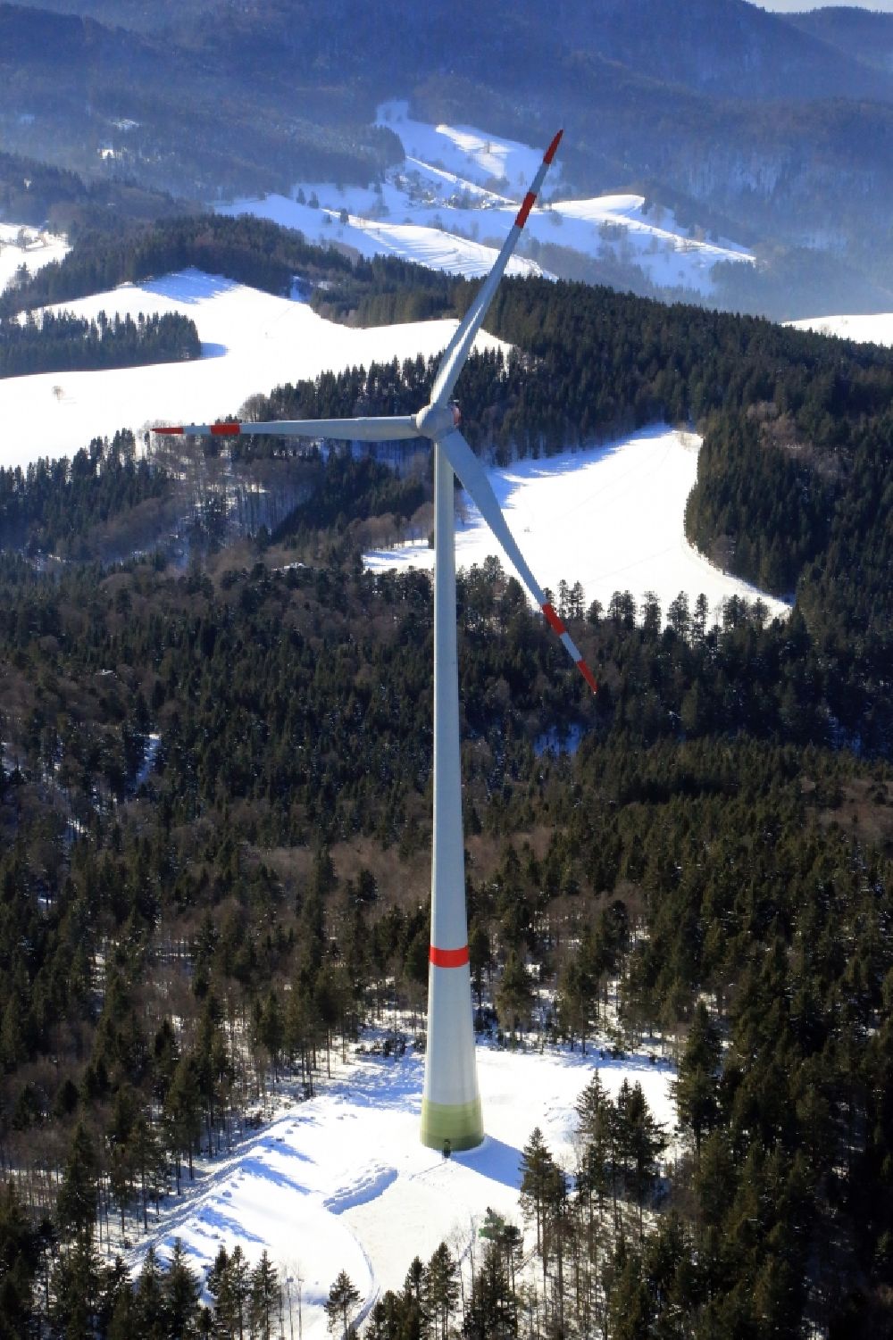 Aerial image Schopfheim - On the snow covered Rohrenkopf, the local mountain of Gersbach, a district of Schopfheim in Baden-Wuerttemberg, wind turbines have started operation. It is the first wind farm in the south of the Black Forest
