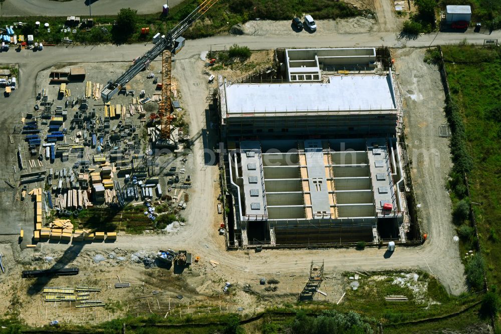 Münchehofe from above - Construction site for the new construction of a flocculation filtration for the expansion of the sewage treatment plant basin and cleaning stages for the waste water treatment of the Berliner Wasserbetriebe on Dahlwitzer Landstrasse in Muenchehofe in the state Brandenburg, Germany
