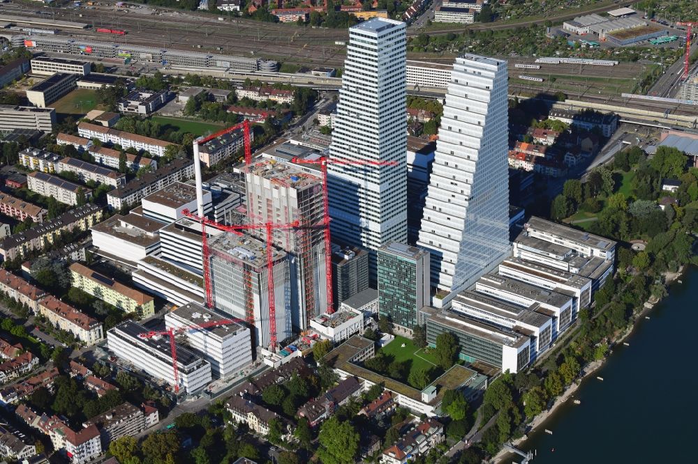 Aerial photograph Basel - Extension construction sites on the premises of the pharmaceutical company Roche with the cityscape-defining high-rise buildings in Basel in Switzerland