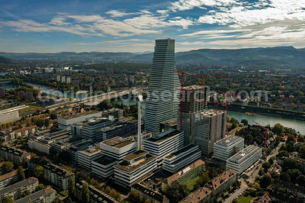 Basel from above - Extension construction sites on the premises of the pharmaceutical company Roche with the cityscape-defining high-rise buildings in Basel in Switzerland