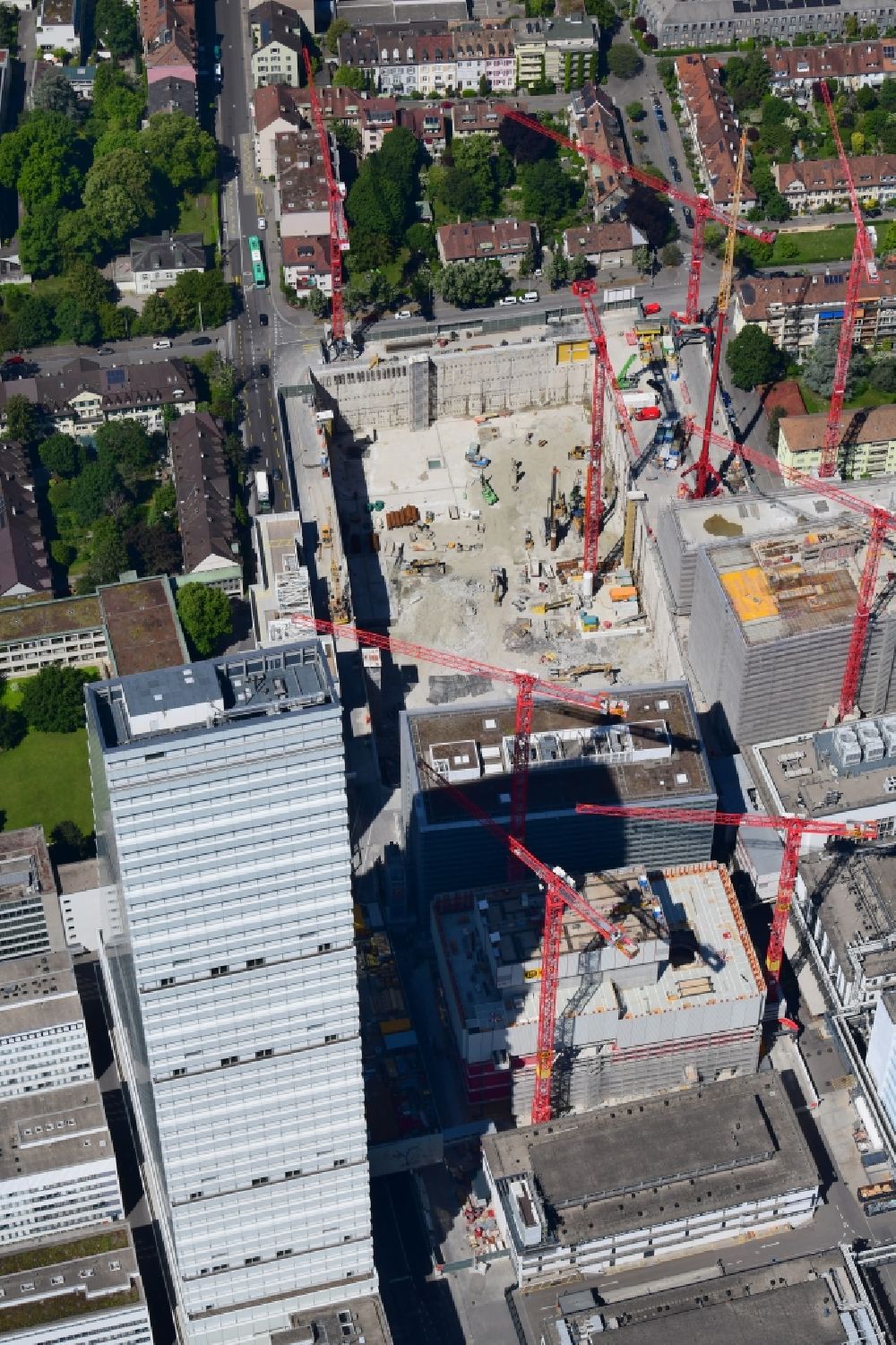 Aerial photograph Basel - Extension construction sites on the premises and premises of the pharmaceutical company Roche with the cityscape-defining high-rise in Basel in Switzerland