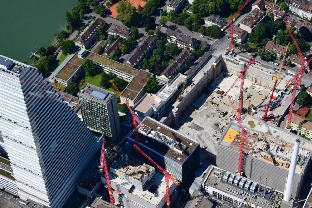 Basel from above - Extension construction sites on the premises and premises of the pharmaceutical company Roche with the cityscape-defining high-rise in Basel in Switzerland