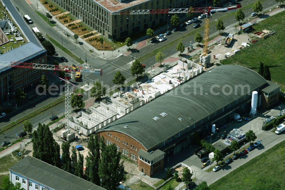Berlin from the bird's eye view: New extension building site on the buildings and production halls on the premises of the Air Liquide Sales Partners Research and Technology Service Schroeder - Technical Gases in the Adlershof district in Berlin, Germany