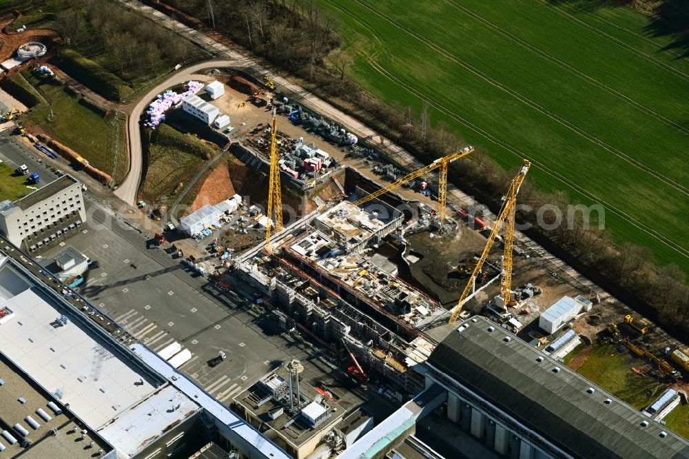 Melsungen from above - Extension - new building - construction site on the factory premises of B. Braun Melsungen AG on Carl-Braun-Strasse in the district Adelshausen in Melsungen in the state Hesse, Germany