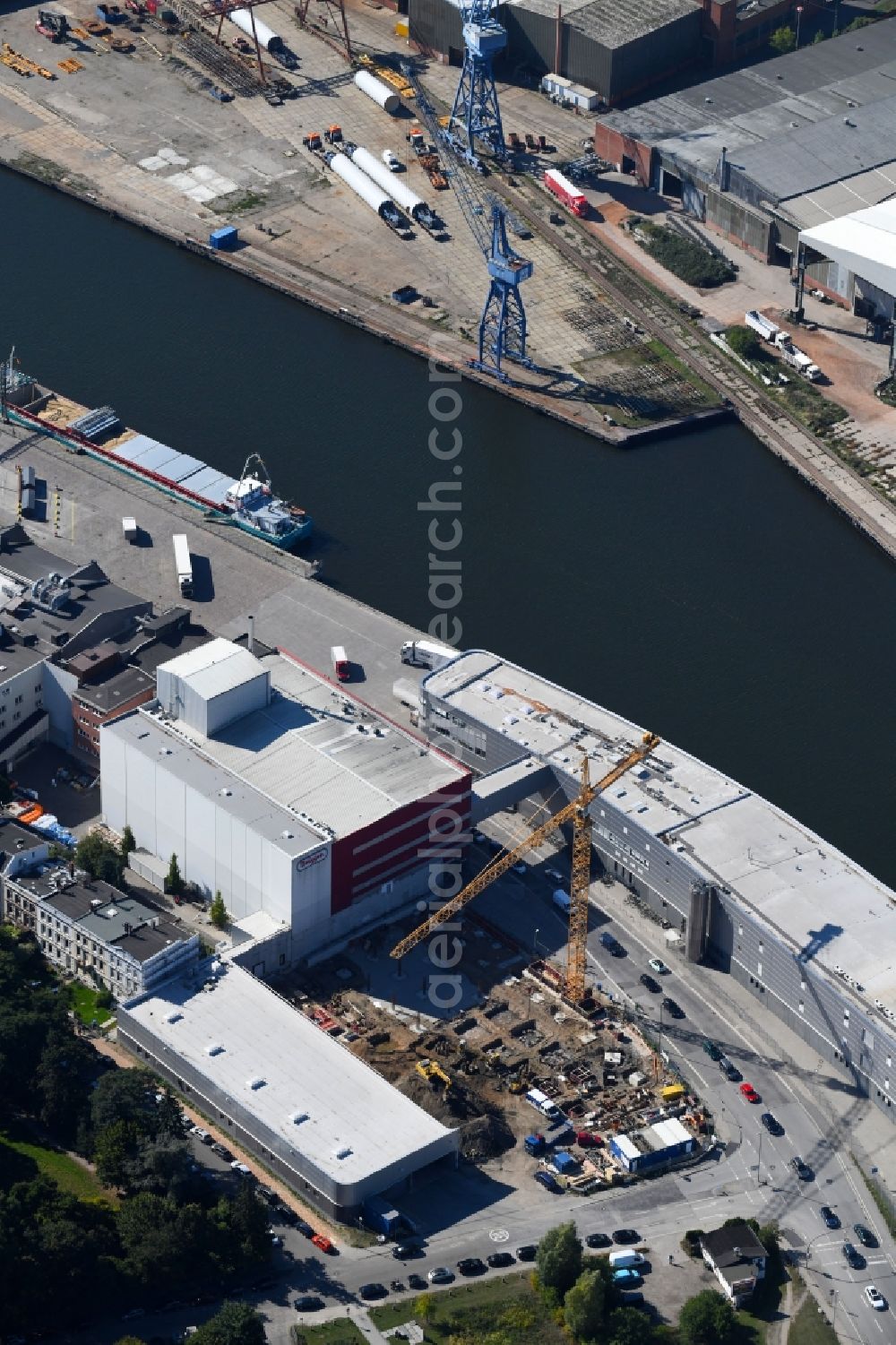 Lübeck from the bird's eye view: Extension - new building - construction site on the factory premises H. & J. Brueggen KG on Gertrudenstrasse in the district Sankt Gertrud in Luebeck in the state Schleswig-Holstein, Germany