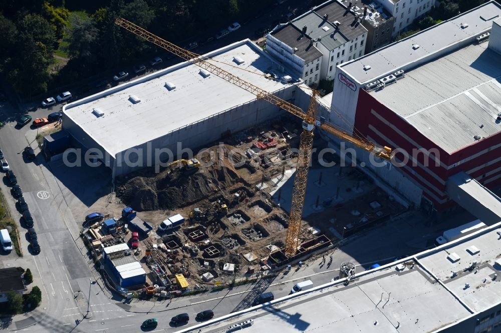 Lübeck from the bird's eye view: Extension - new building - construction site on the factory premises H. & J. Brueggen KG on Gertrudenstrasse in the district Sankt Gertrud in Luebeck in the state Schleswig-Holstein, Germany
