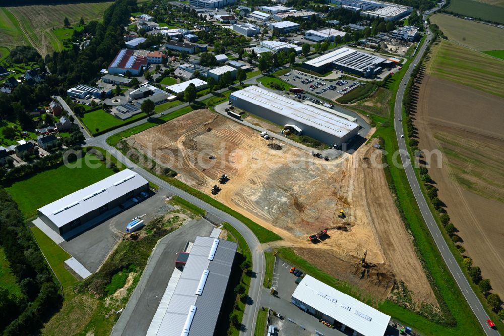 Treuen from above - Extension - new building - construction site on the factory premises of EMW Treuen GmbH on street Herlasgruener Strasse - Am Wasserturm in the district Hartmannsgruen in Treuen in the state Saxony, Germany