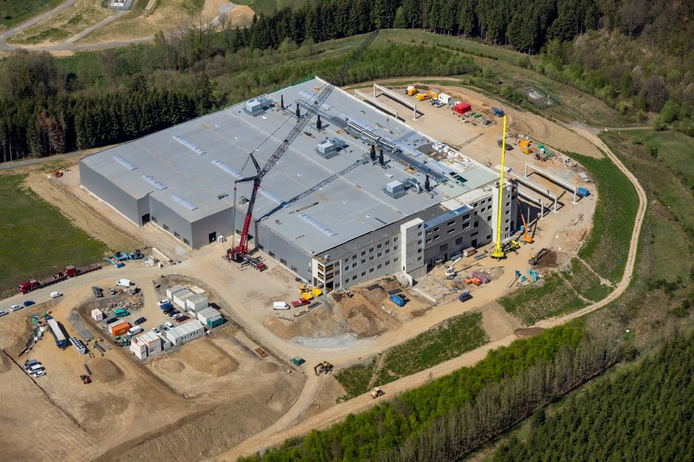 Altena from the bird's eye view: Extension - new building - construction site on the factory premises in the commercial area in Rosmart in the state North Rhine-Westphalia, Germany