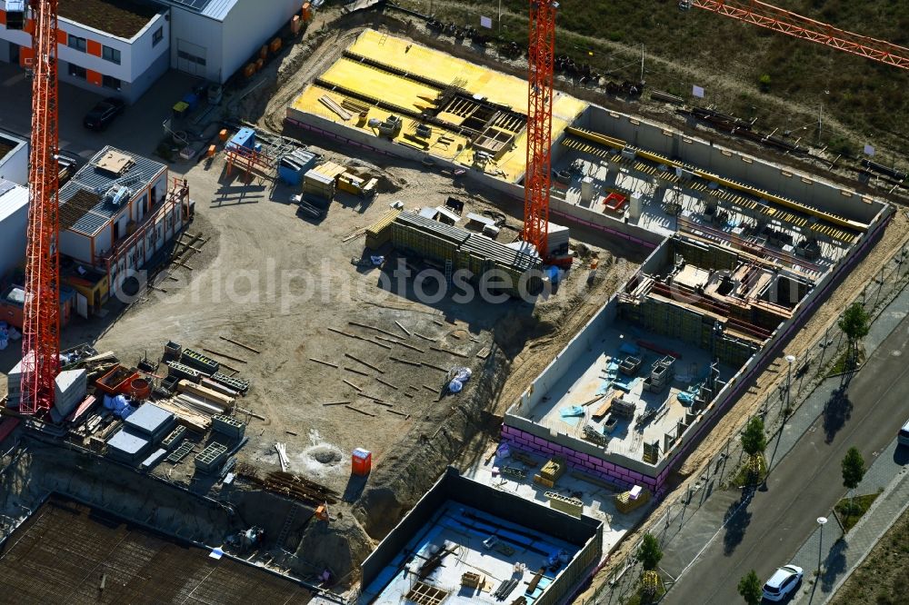 Berlin from the bird's eye view: Extension - new building - construction site on the factory premises of Hirsch + Lorenz Ingenieurbau GmbH on Gerhard-Sedlmayr-Strasse in the district Johannisthal in Berlin, Germany