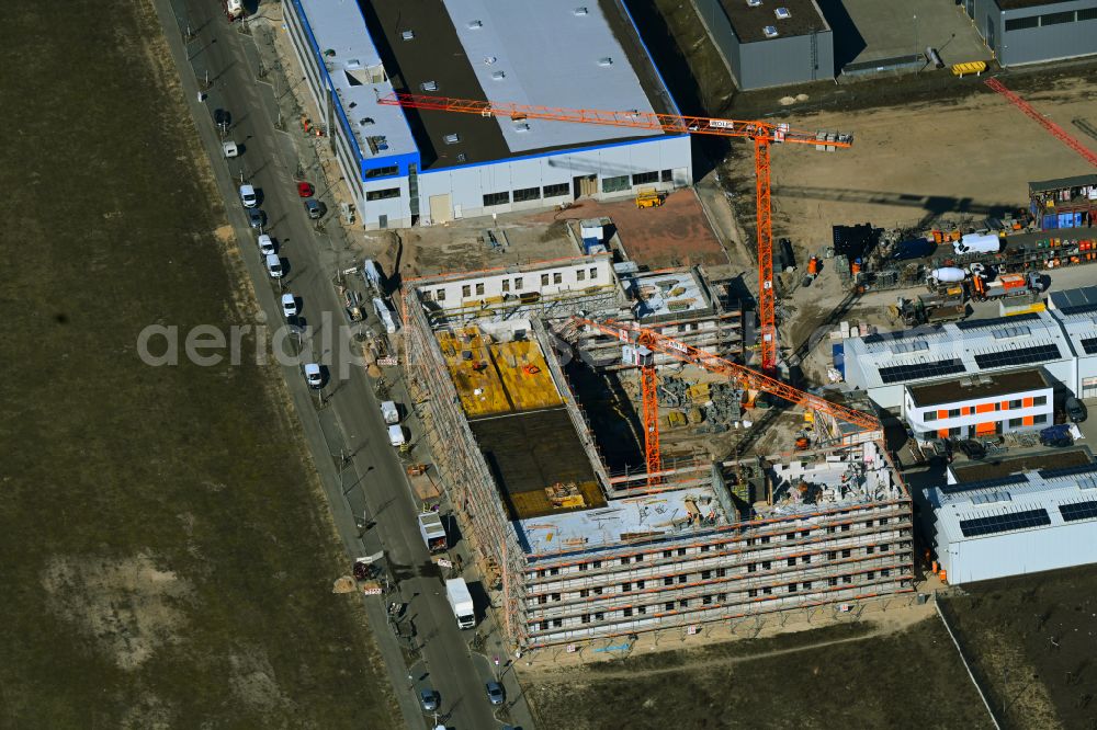 Berlin from the bird's eye view: Extension - new building - construction site on the factory premises of Hirsch + Lorenz Ingenieurbau GmbH on Gerhard-Sedlmayr-Strasse on street Gross-Berliner Damm in the district Johannisthal in Berlin, Germany