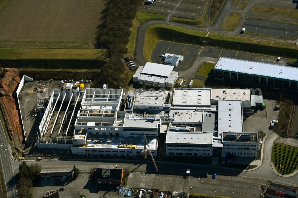 Melsungen from the bird's eye view: Extension - new building - construction site on the factory premises of Solupharm Pharmazeutische Erzeugnisse GmbH on Industriestrasse in the district Adelshausen in Melsungen in the state Hesse, Germany