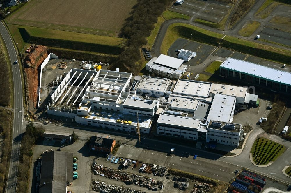 Aerial image Melsungen - Extension - new building - construction site on the factory premises of Solupharm Pharmazeutische Erzeugnisse GmbH on Industriestrasse in the district Adelshausen in Melsungen in the state Hesse, Germany