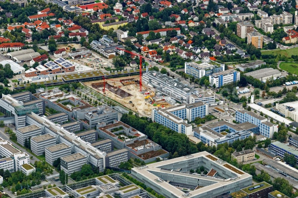 Unterföhring from the bird's eye view: Expansion site on the building complex of the transmitter New Campus of ProSieben Sat.1 Media SE on Medienallee - Gutenbergstrasse in Unterfoehring in the state Bavaria, Germany
