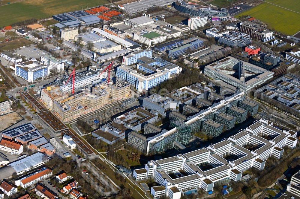 Aerial image Unterföhring - Expansion site on the building complex of the transmitter New Campus of ProSieben Sat.1 Media SE on Medienallee - Gutenbergstrasse in Unterfoehring in the state Bavaria, Germany