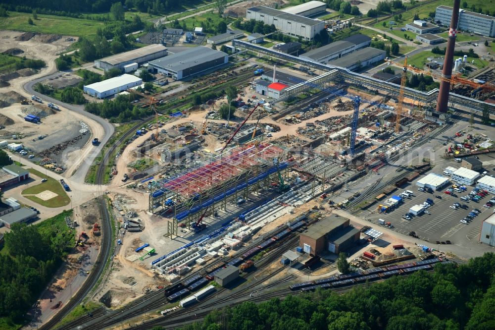 Ilsenburg (Harz) from the bird's eye view: Construction site on building and production halls on the premises of Ilsenburger Grobblech GmbH in Ilsenburg (Harz) in the state Saxony-Anhalt, Germany