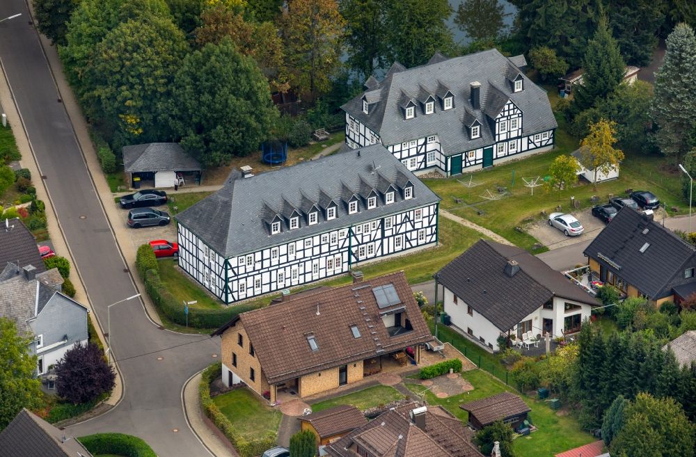 Kreuztal from the bird's eye view: Half-timbered house and multiple dwelling on the Jakob-Henrich-Strasse corner Wildenburger Strasse in Kreuztal in the state of North Rhine-Westphalia, Germany