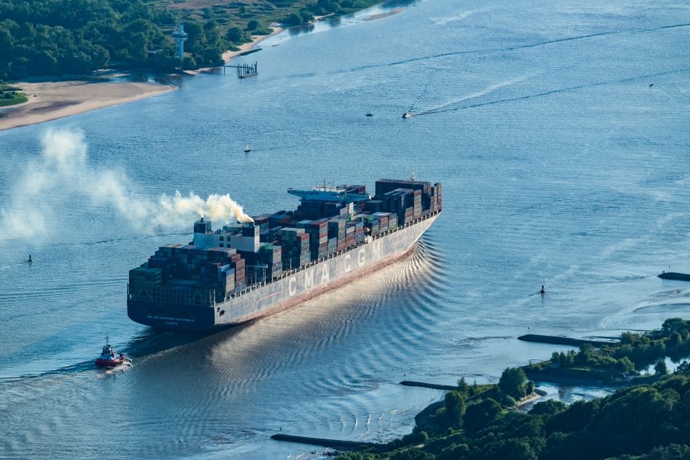 Aerial photograph Hamburg - Sailing container ship CMA CGM Alexander von Humboldt in operation on elbe river in the district Finkenwerder in Hamburg, Germany
