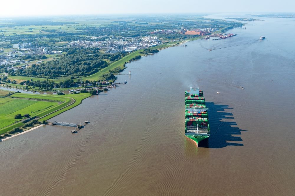 Stade from the bird's eye view: Sailing container ship Ever Ace at the Elbe river in Hamburg, Germany